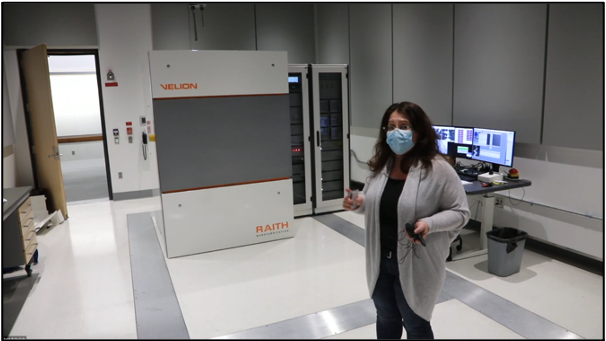 Anna Osherov, assistant director of user services at Characterization.nano, leads a tour of the imaging suites. Here, she is telling participants about the VELION focused-ion beam scanning electron microscope.