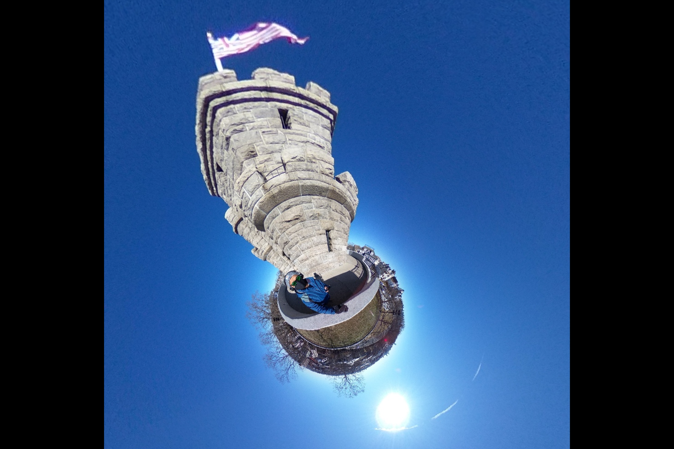 Rohan Kundargi, Program Administrator for MIT’s Office of Government & Community Relations, uses a Ricoh Theta Z1 360 camera and monopod to practice his 360-degree photography skills at the Prospect Hill Monument in Somerville, MA.