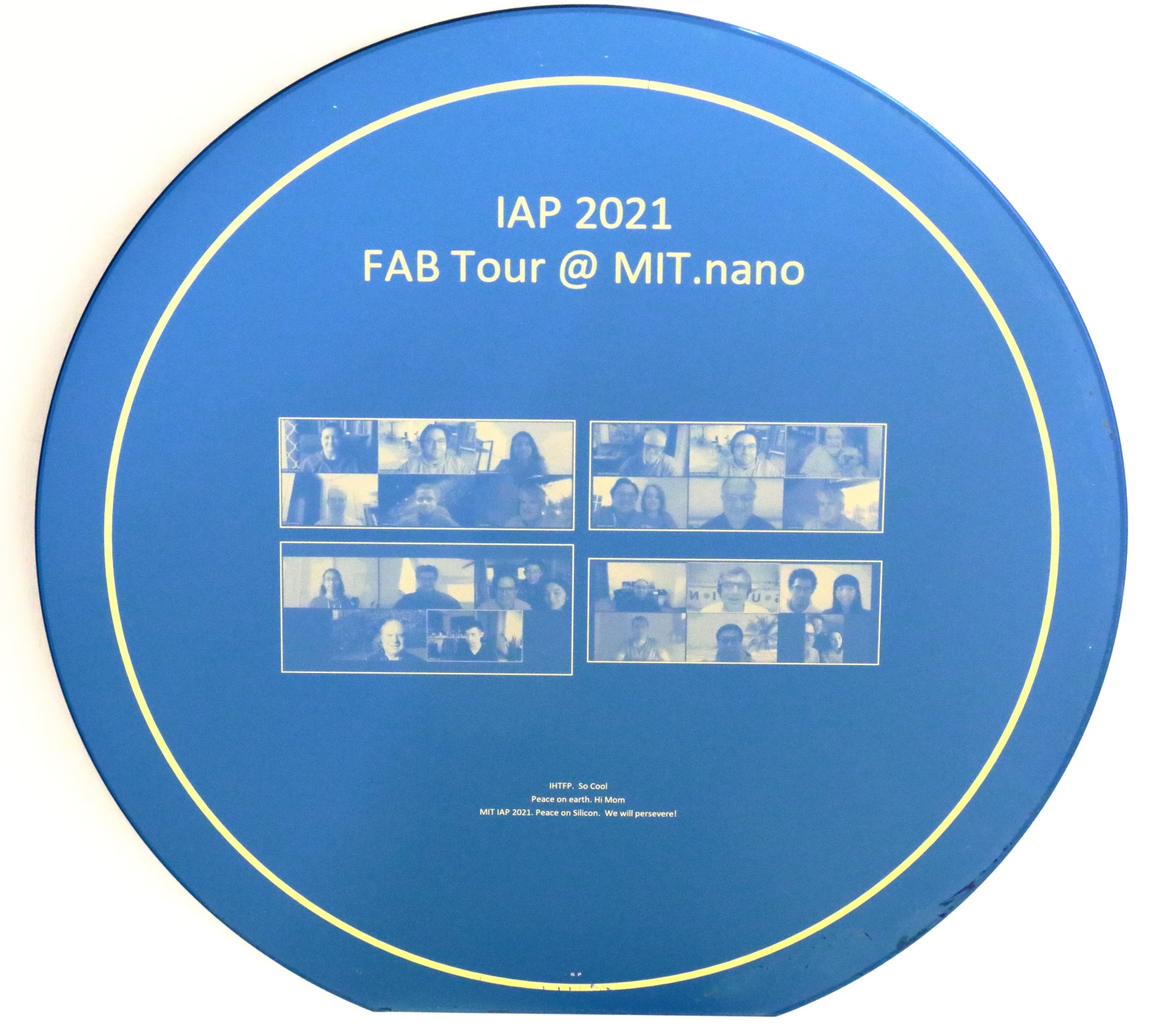 A screenshot of Zoom participants is printed on a silicon wafer with a 100 nanometer (nm) thin gold film. The light blue is the thin film interference of 100 nm of Silicon-Nitride on Silicon.