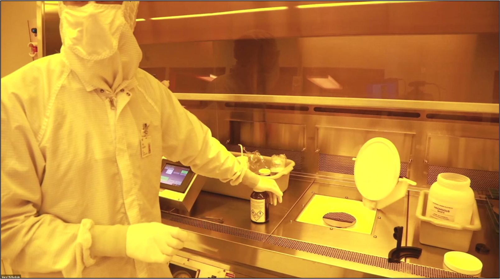 To pattern the thin layer of gold, scientists spin-coat the wafer with photoresist.  Here, the wafer is loaded onto a manual coater, and Assistant Director for User Services Jorg Scholvin is getting ready to apply the photoresist (in the bottle).