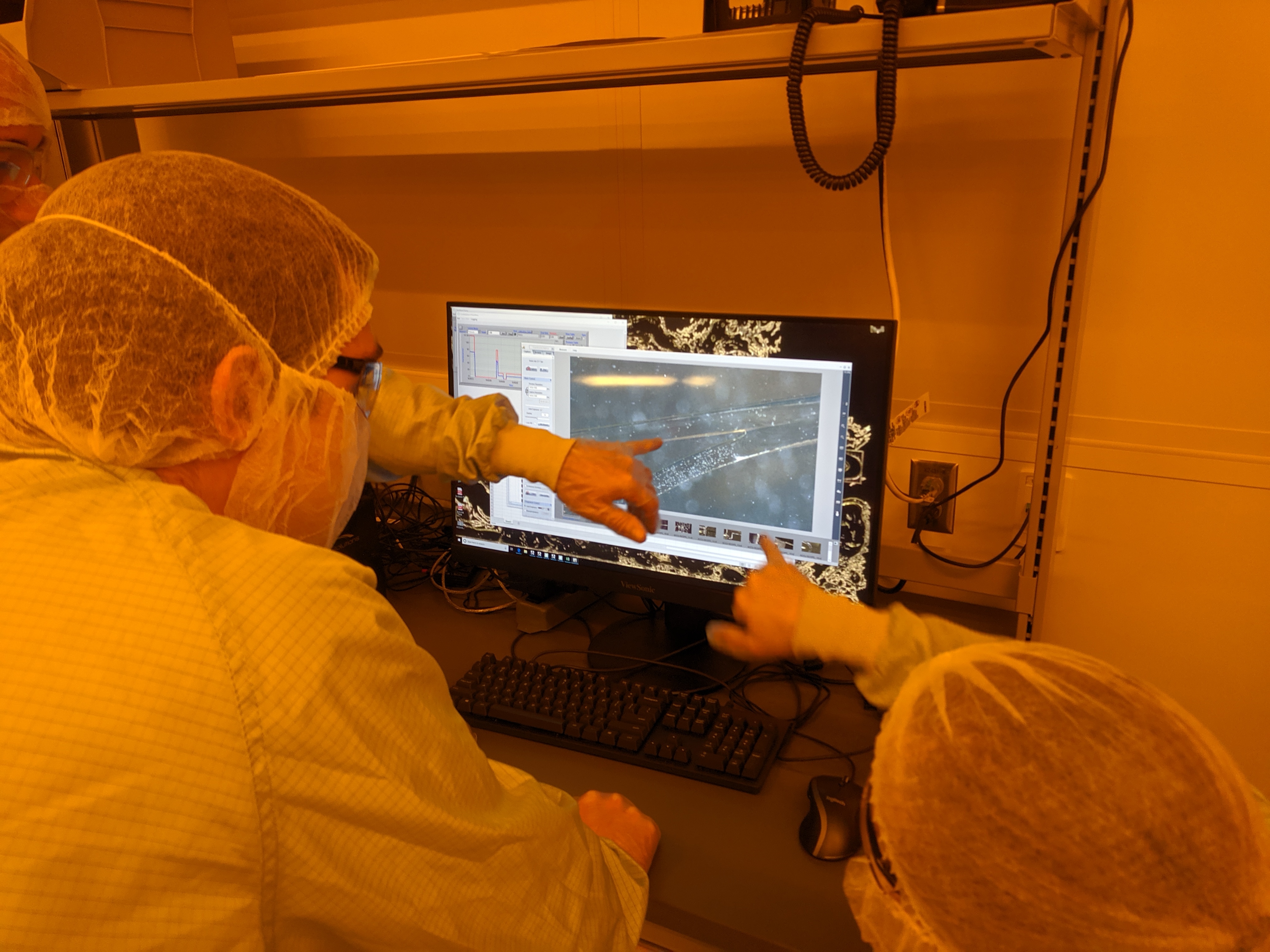 students investigate particles on screen