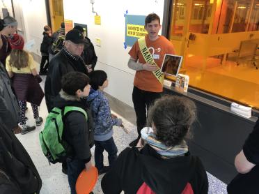 A student gives a tour of MIT.nano a group of visitors.