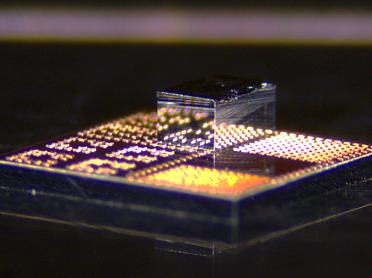 Researchers have developed a new fabrication process that integrates high-performance gallium nitride transistors onto standard silicon CMOS chips in a way that is low-cost and scalable.