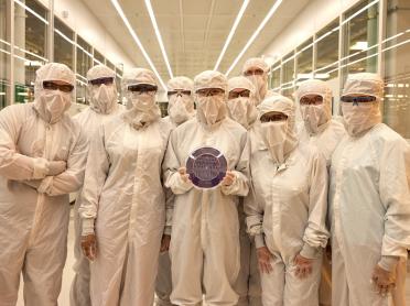 A group of people in bunnysuits in a cleanroom