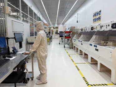 A researcher uses a workstation inside MIT.nano's cleanroom