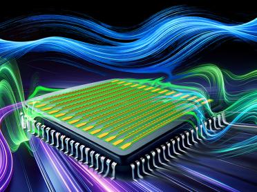 A computer chip with blue, green, and purple waves