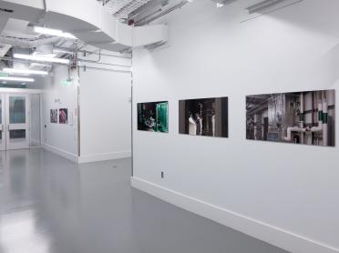 Three photographs on a white wall